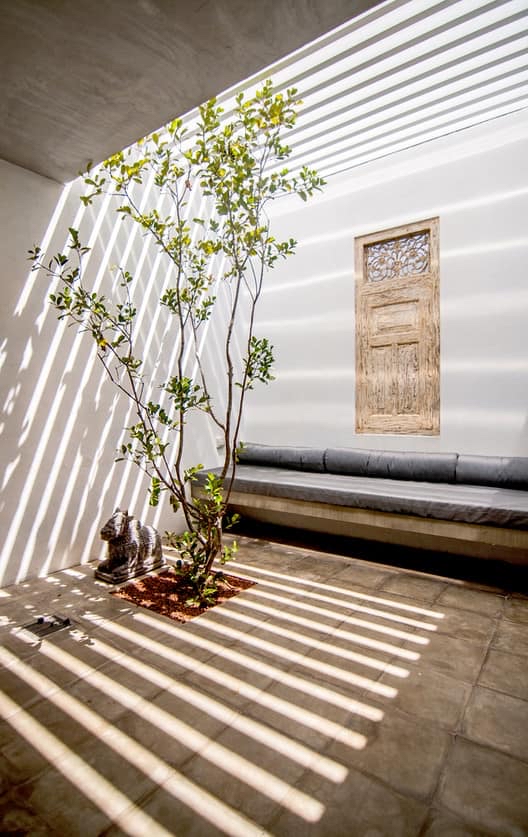 Quiet interior space with natural light, evoking calm and bodily settling